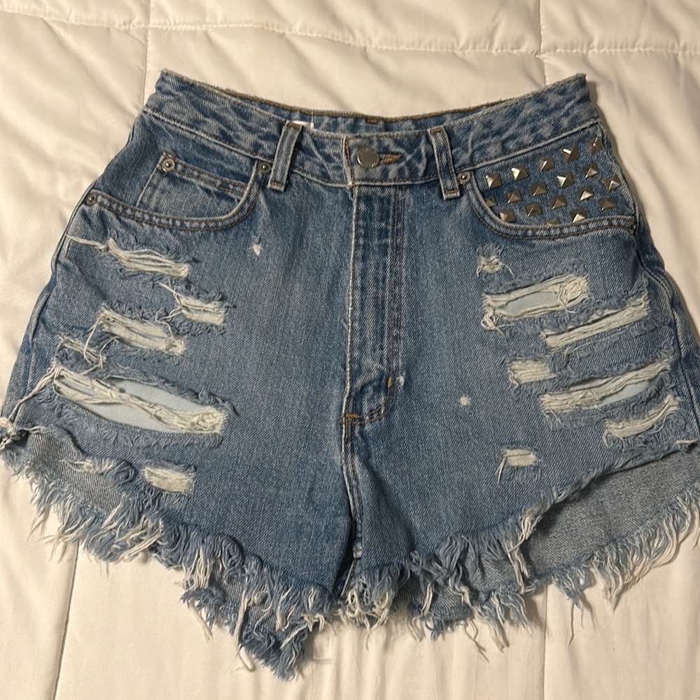 Distressed high waisted jean shorts with stud details